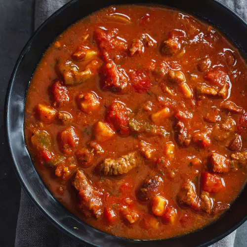 meat-vegetable-stew-served-dark-bowl-grey-background.jpg